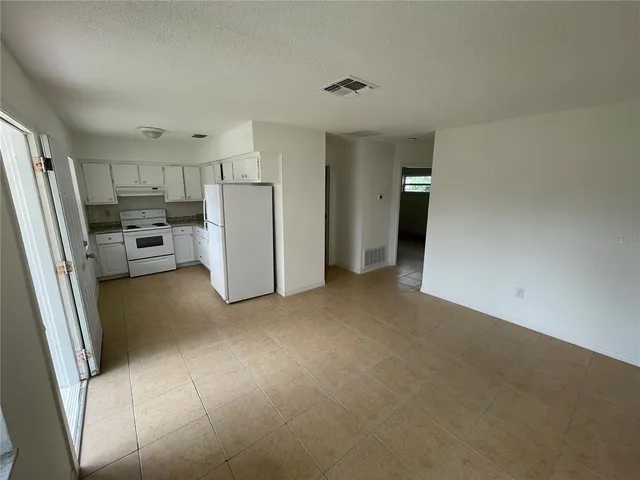 a view of a bathroom with mirror