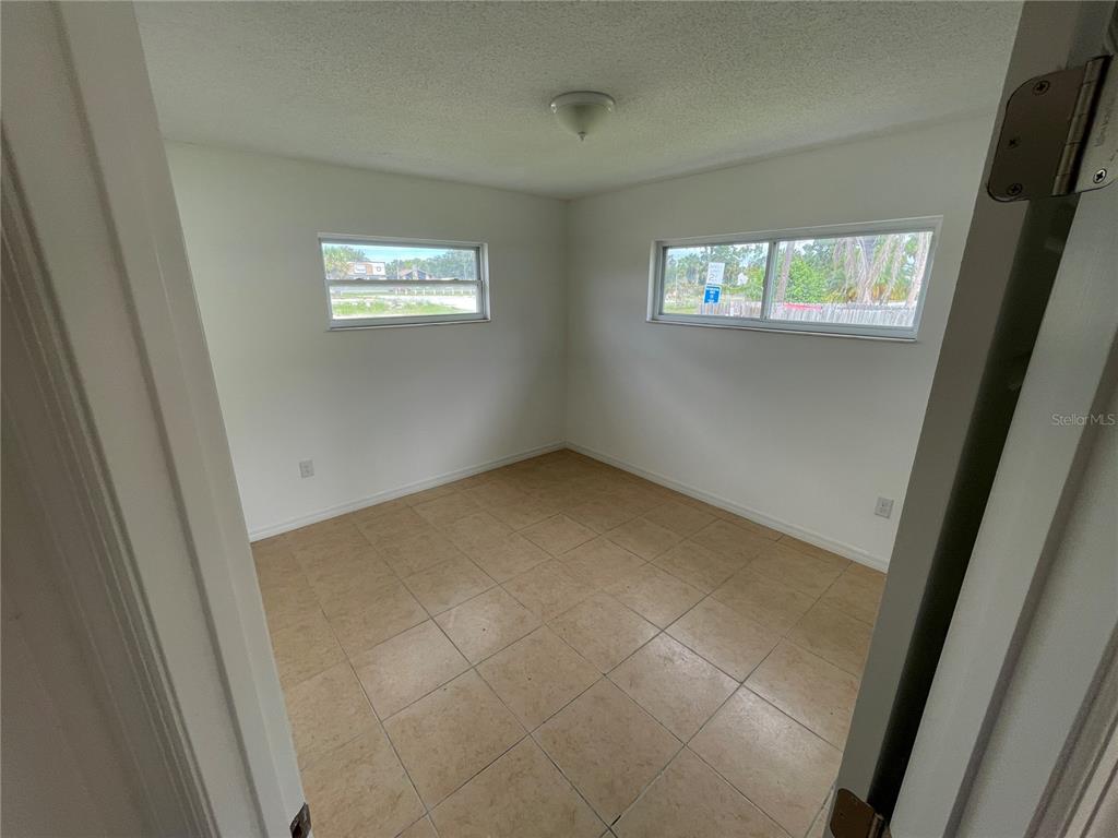 5305 Avery Road New Port Richey, FL 34652 - Photo 25 of 29 a view of an empty room with a window