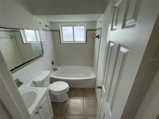 a view of a bathroom from a hallway