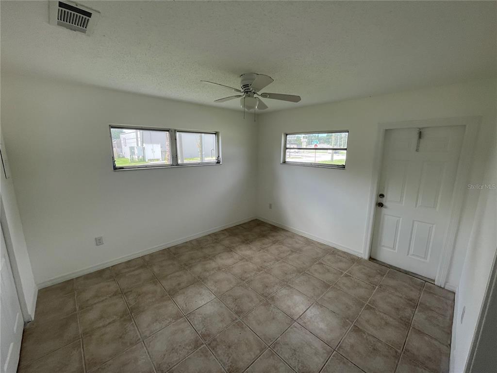 5305 Avery Road New Port Richey, FL 34652 - Photo 10 of 29 an empty room with windows and fan