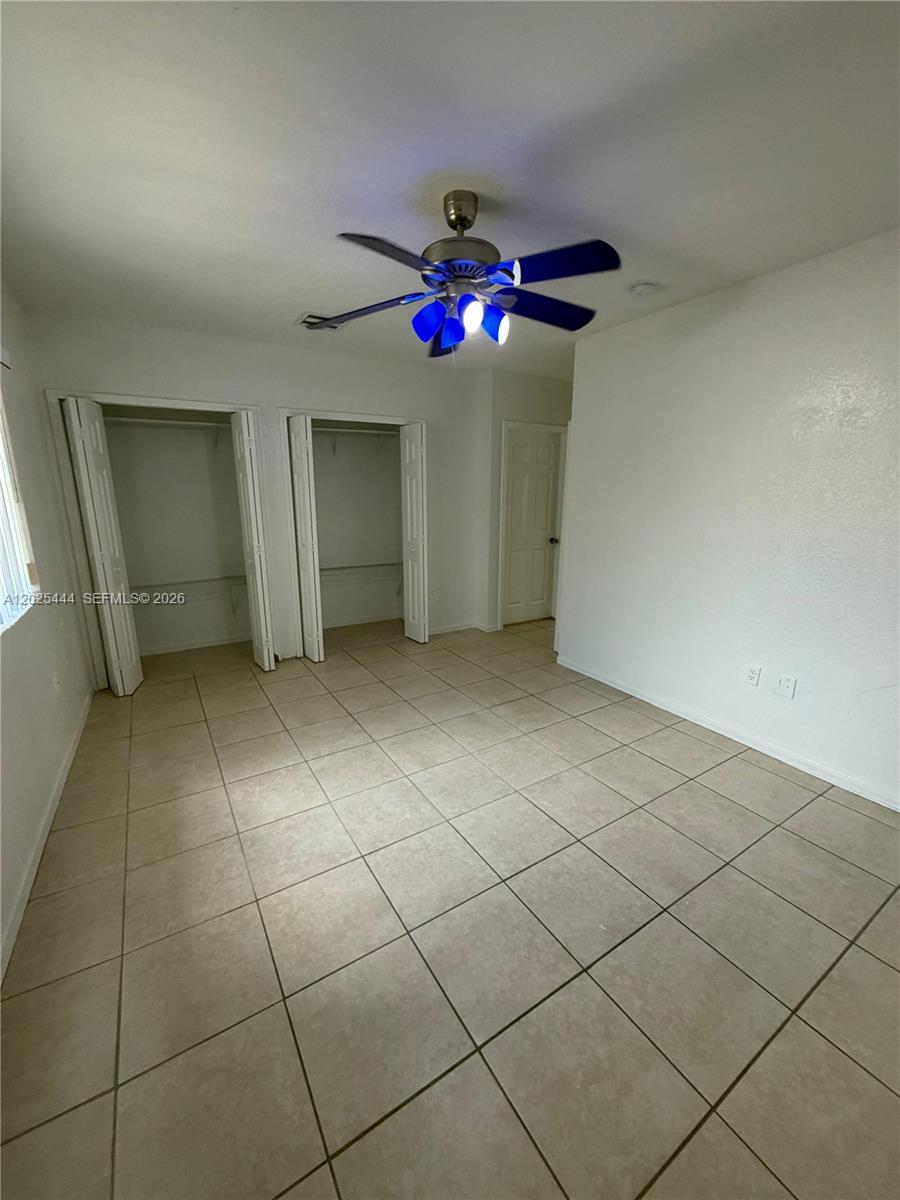 681 Southwest 7th Street, Unit 681 Florida City, FL 33034 - Photo 15 of 16 a view of an empty room with a window
