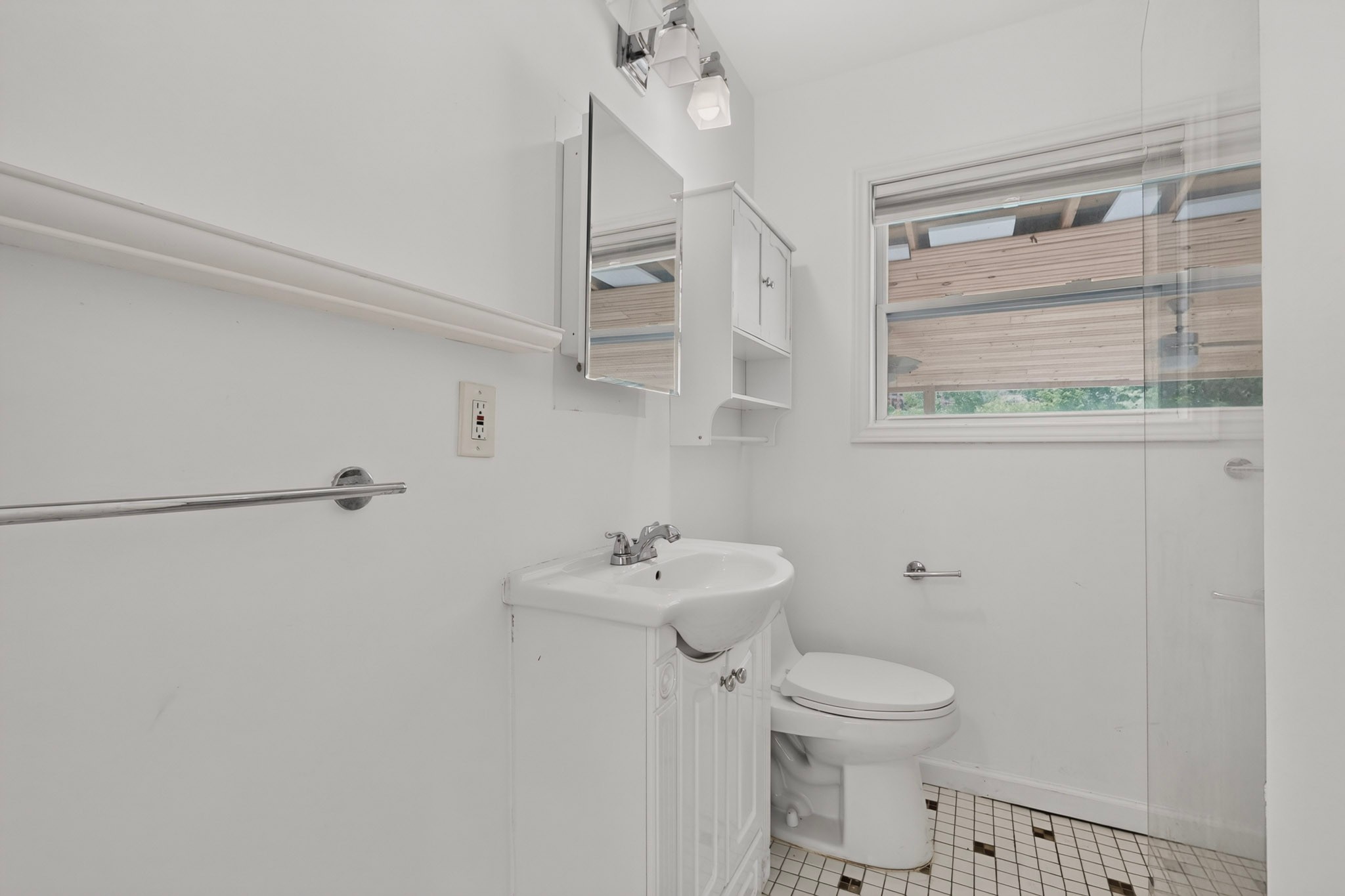 4711 Alf Avenue Austin, TX 78721 - Photo 21 of 34 Full bath features white vanity, white cabinet, and tile flooring