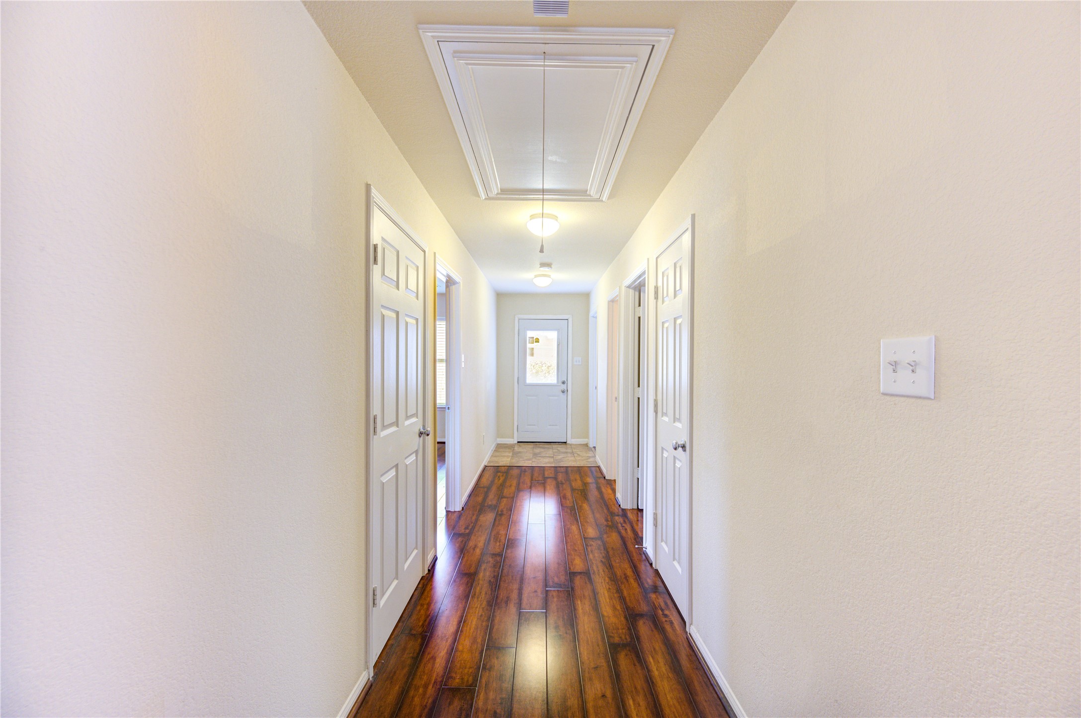 2922 Halcyon Time Trail Houston, TX 77045 - Photo 23 of 50 a view of a hallway with wooden floor and staircase