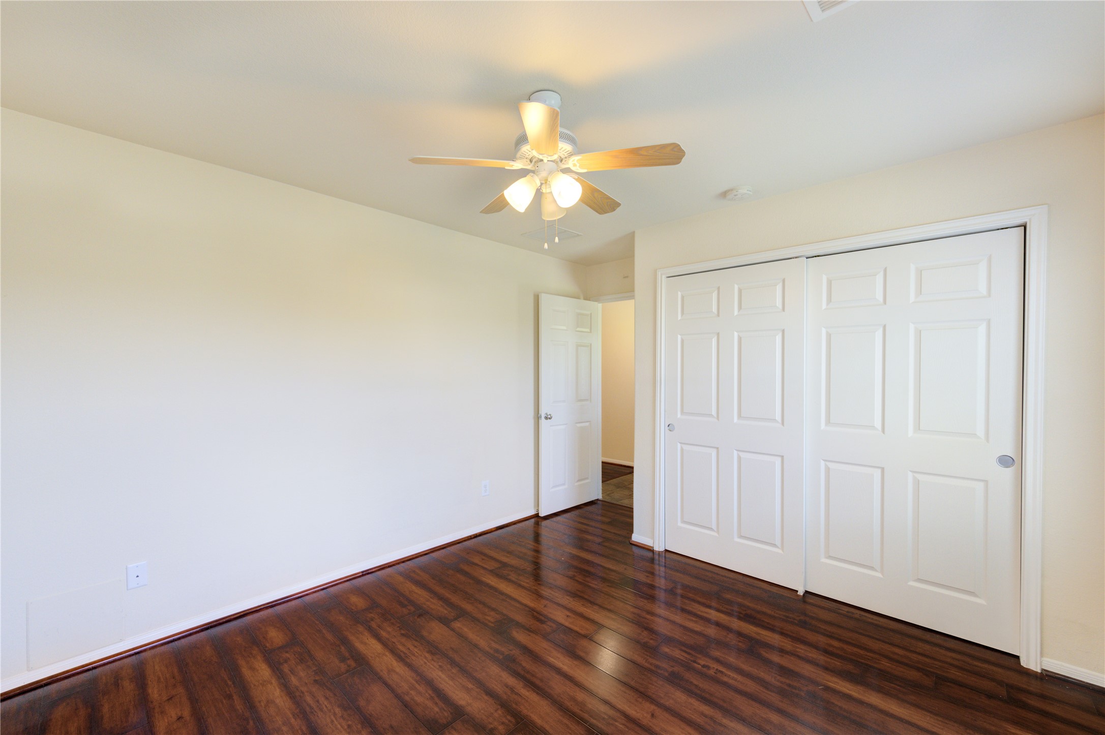 2922 Halcyon Time Trail Houston, TX 77045 - Photo 36 of 50 a view of an empty room with wooden floor