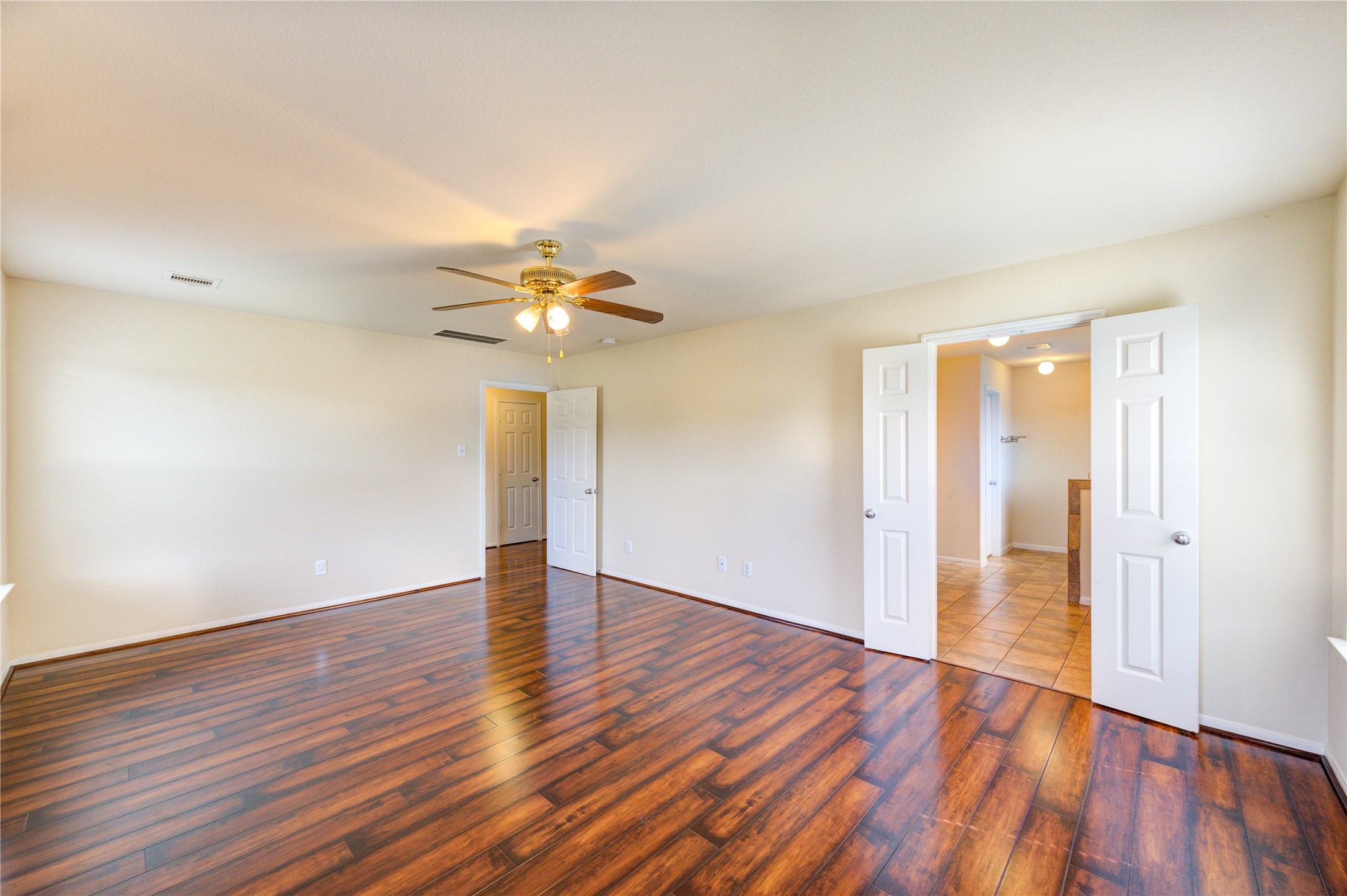 2922 Halcyon Time Trail Houston, TX 77045 - Photo 43 of 50 a view of an empty room with wooden floor and a window