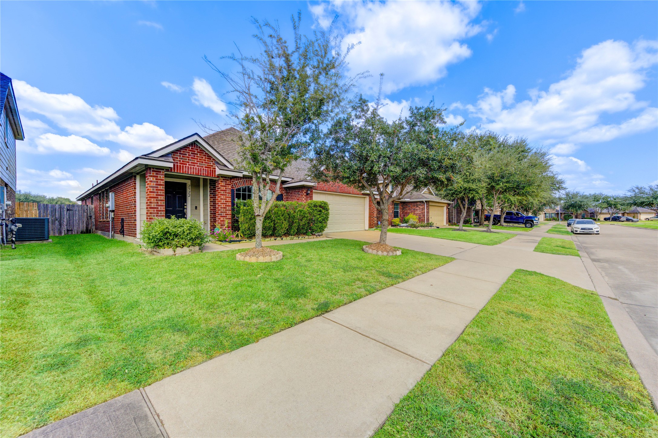2922 Halcyon Time Trail Houston, TX 77045 - Photo 5 of 50 a front view of house with yard and green space