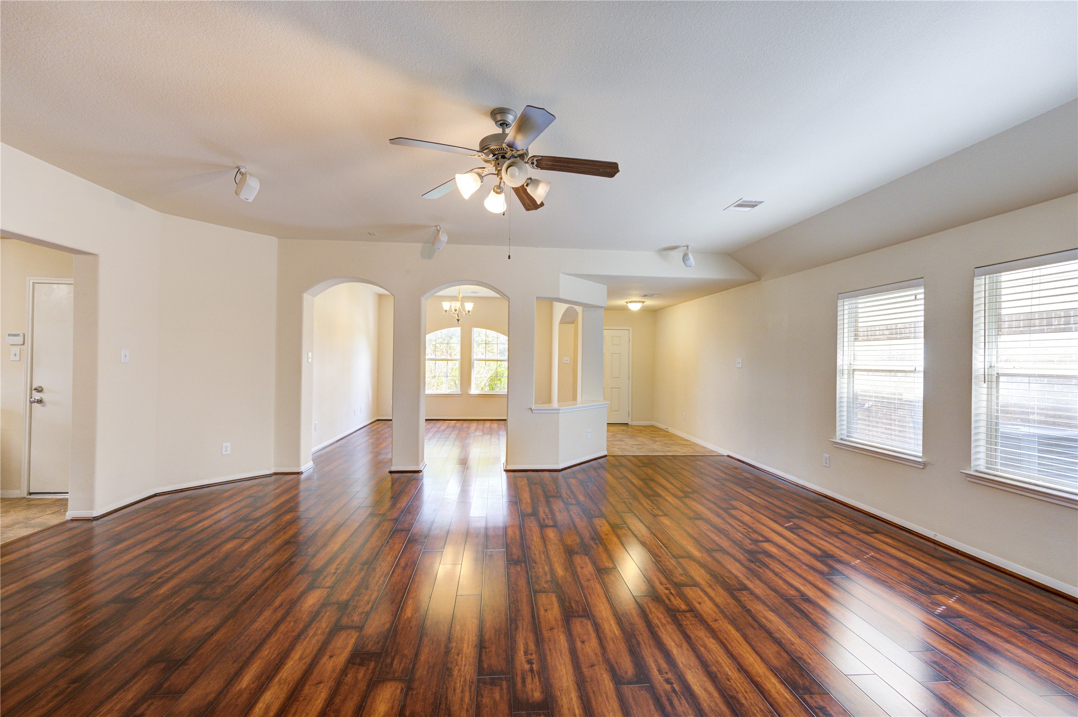 2922 Halcyon Time Trail Houston, TX 77045 - Photo 10 of 50 a view of empty room with wooden floor and fan