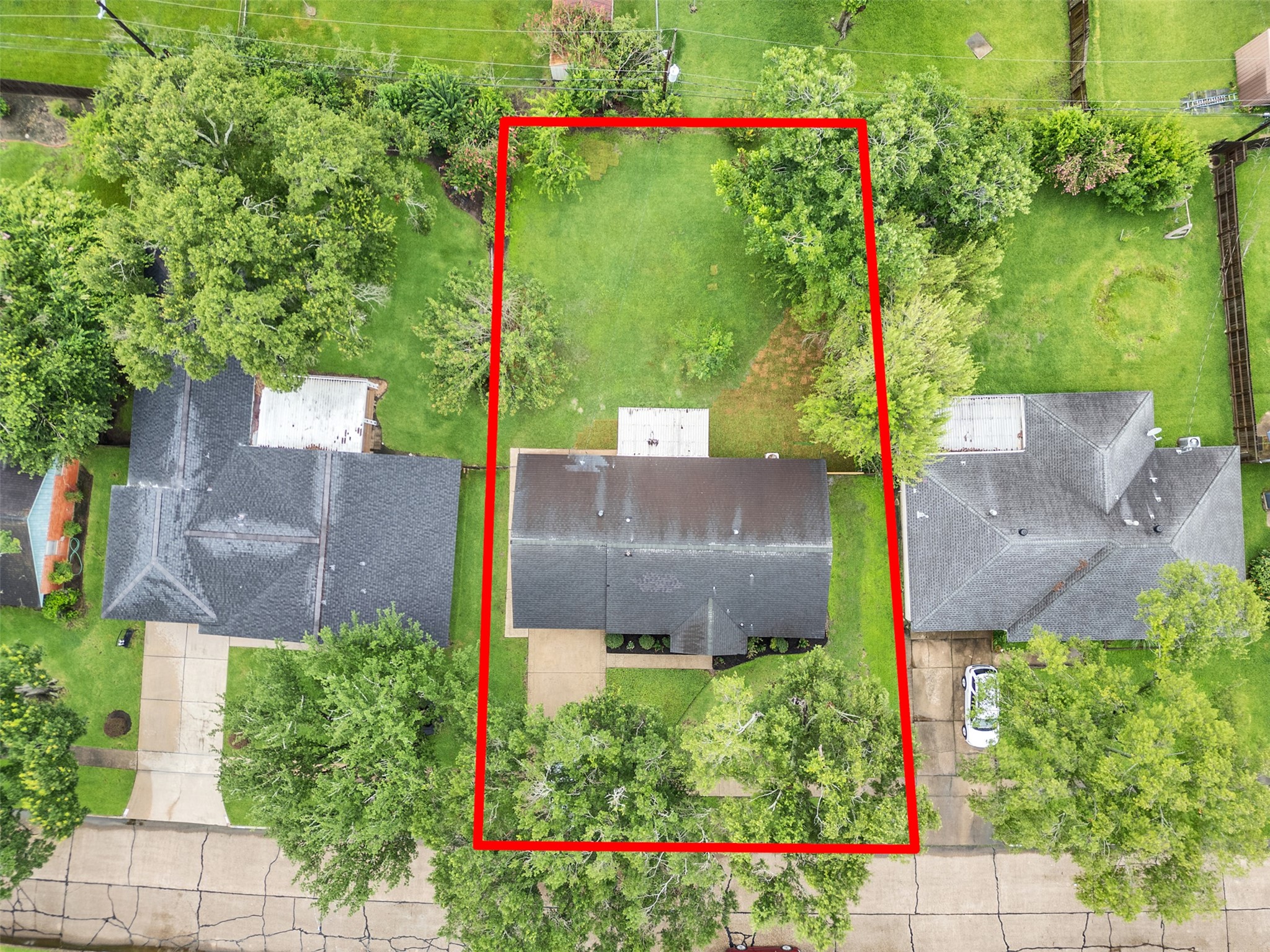 10315 Winding Trail Road La Porte, TX 77571 - Photo 23 of 24 Discover your dream home with a spacious, tree-lined backyard, perfectly outlined for privacy and relaxation.