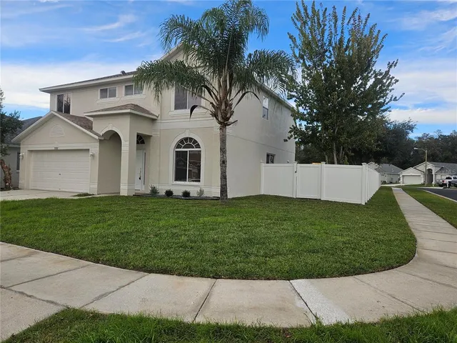 front view of a house with a yard