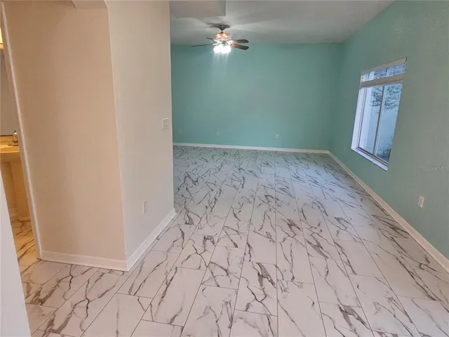 a view of room with window and hardwood floor