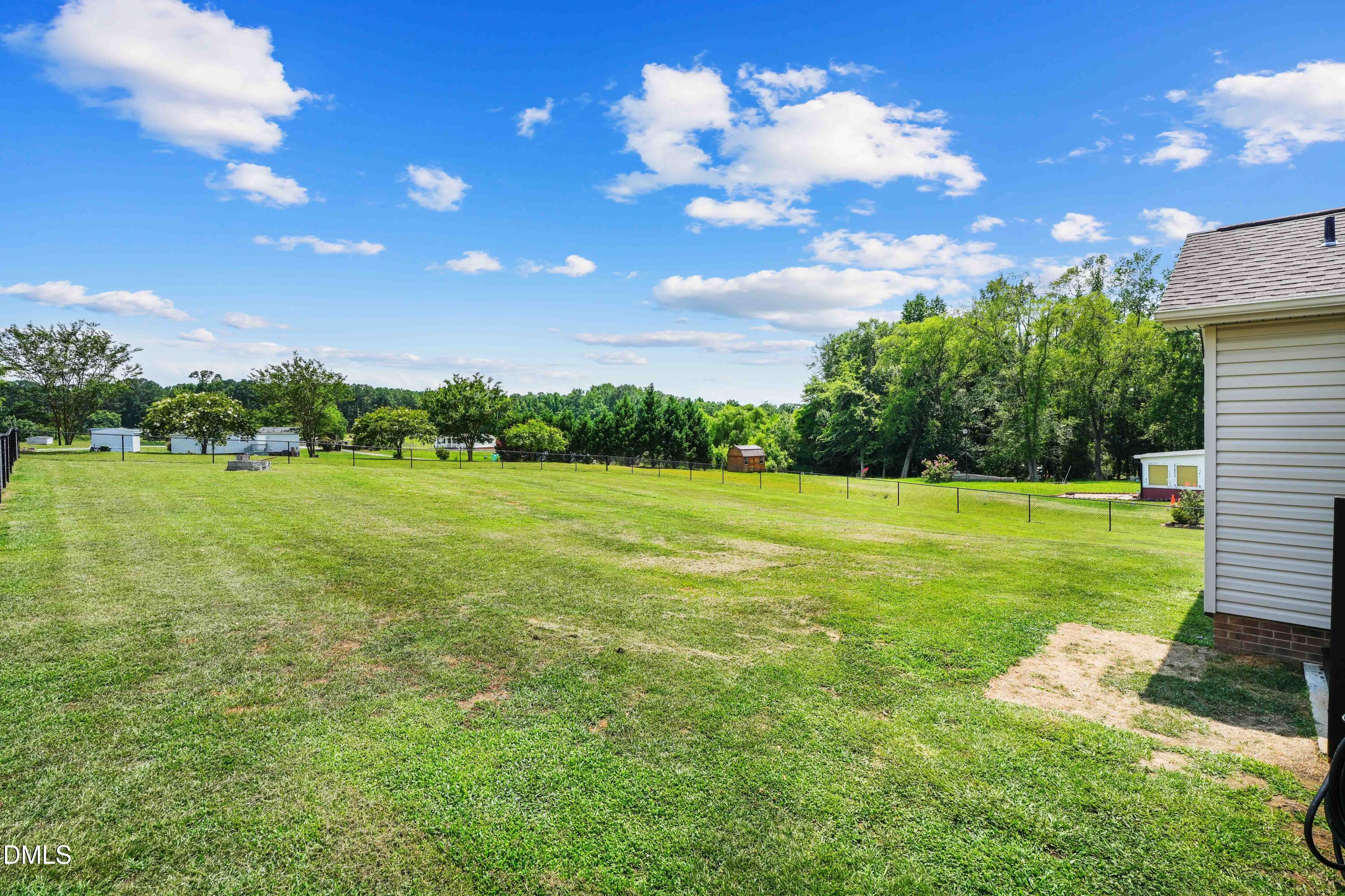 101 Stephenson Road Benson, NC 27504 - Photo 28 of 29 a view of a building with a big yard