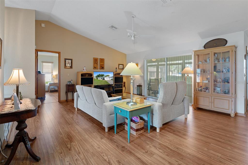 5035 Harbinger Road Spring Hill, FL 34608 - Photo 18 of 47 a living room with furniture and a wooden floor