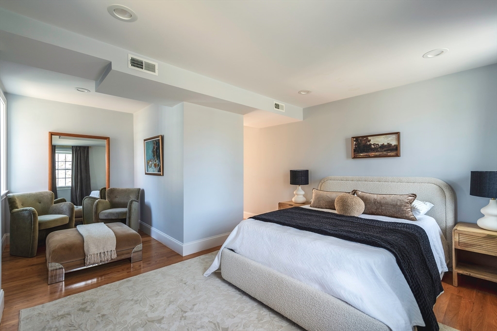 64 County Road, Unit 1 Ipswich, MA 01938 - Photo 15 of 33 a bedroom with a bed and furniture
