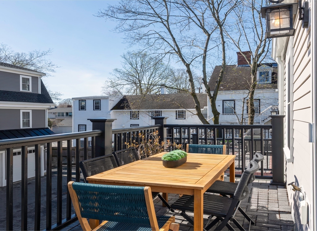 64 County Road, Unit 1 Ipswich, MA 01938 - Photo 20 of 33 a view of a patio with a table and chairs