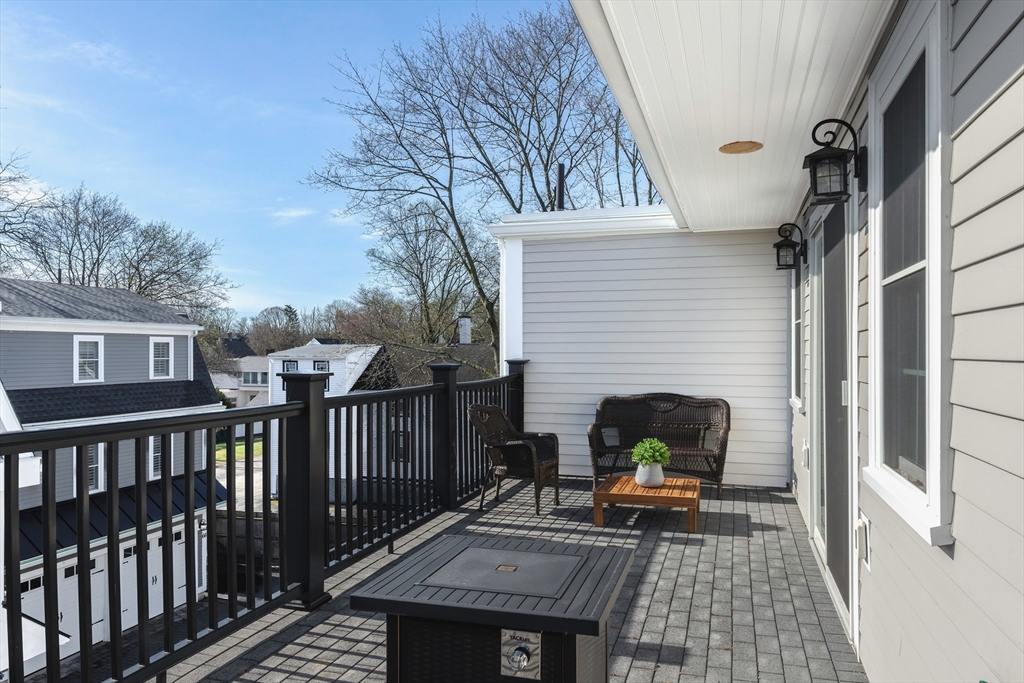 64 County Road, Unit 1 Ipswich, MA 01938 - Photo 26 of 33 a view of a patio with a table and chairs