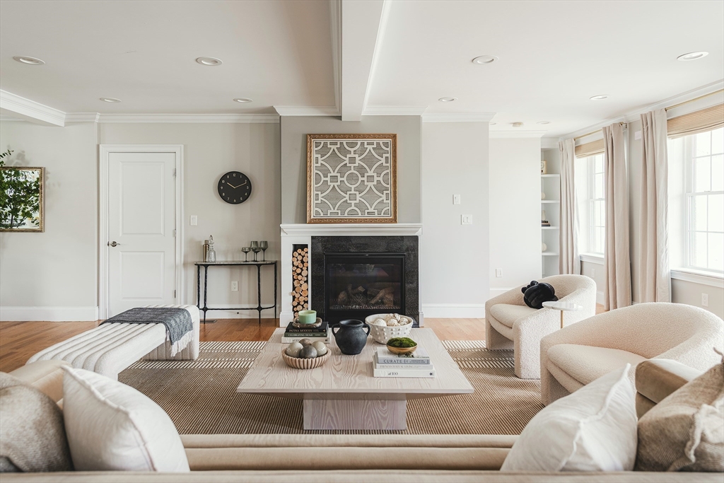 64 County Road, Unit 1 Ipswich, MA 01938 - Photo 8 of 33 a living room with furniture and a fireplace