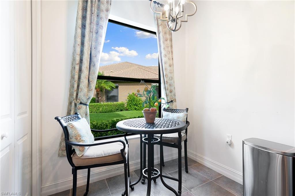7563 Moorgate Point Way Naples, FL 34113 - Photo 20 of 40 a view of a dining room with furniture window and outside view