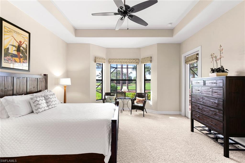 7563 Moorgate Point Way Naples, FL 34113 - Photo 23 of 40 a bedroom with a bed and a couch