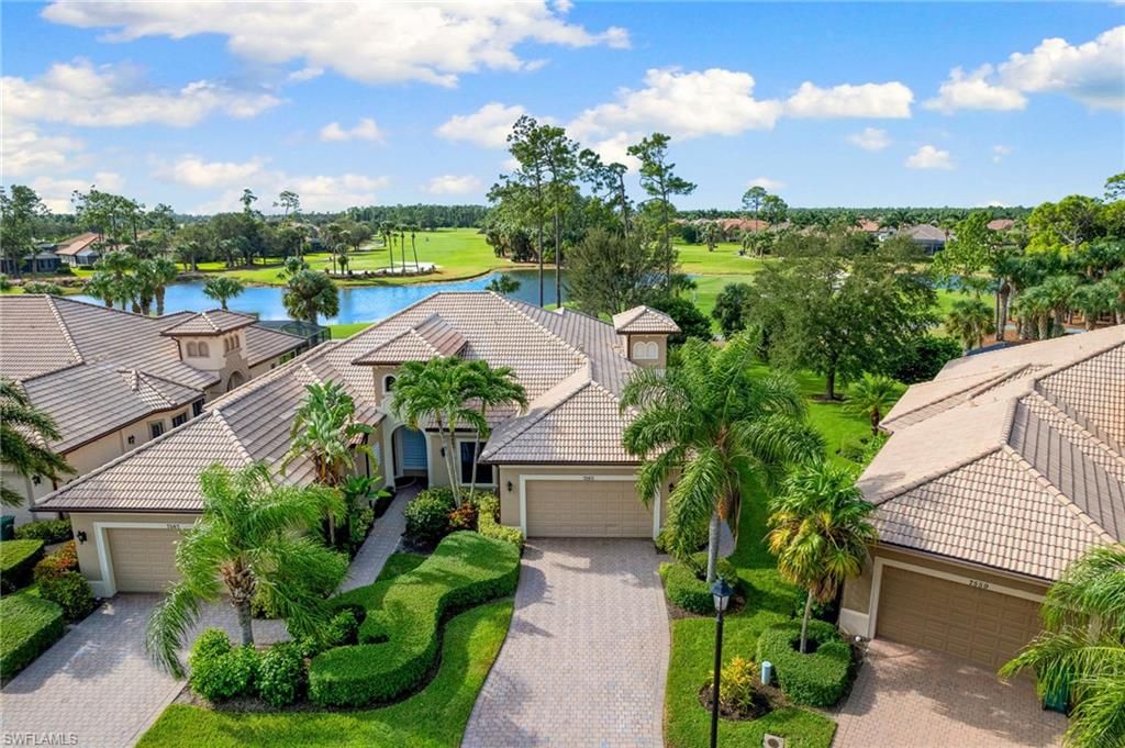 7563 Moorgate Point Way Naples, FL 34113 - Photo 29 of 40 an aerial view of multiple house