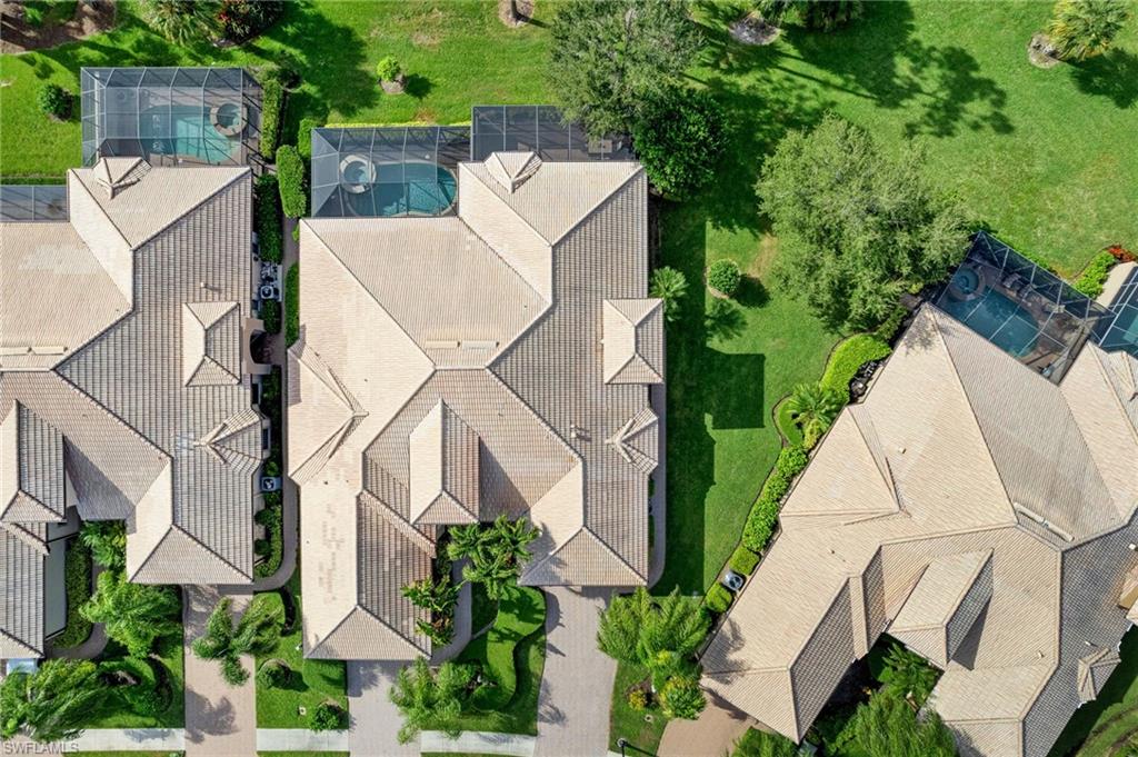 7563 Moorgate Point Way Naples, FL 34113 - Photo 30 of 40 an aerial view of a house with yard and patio