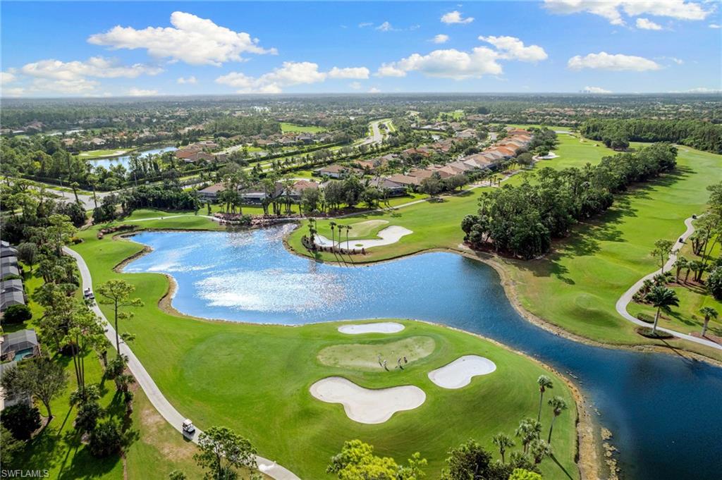 7563 Moorgate Point Way Naples, FL 34113 - Photo 31 of 40 an aerial view of a swimming pool with a yard