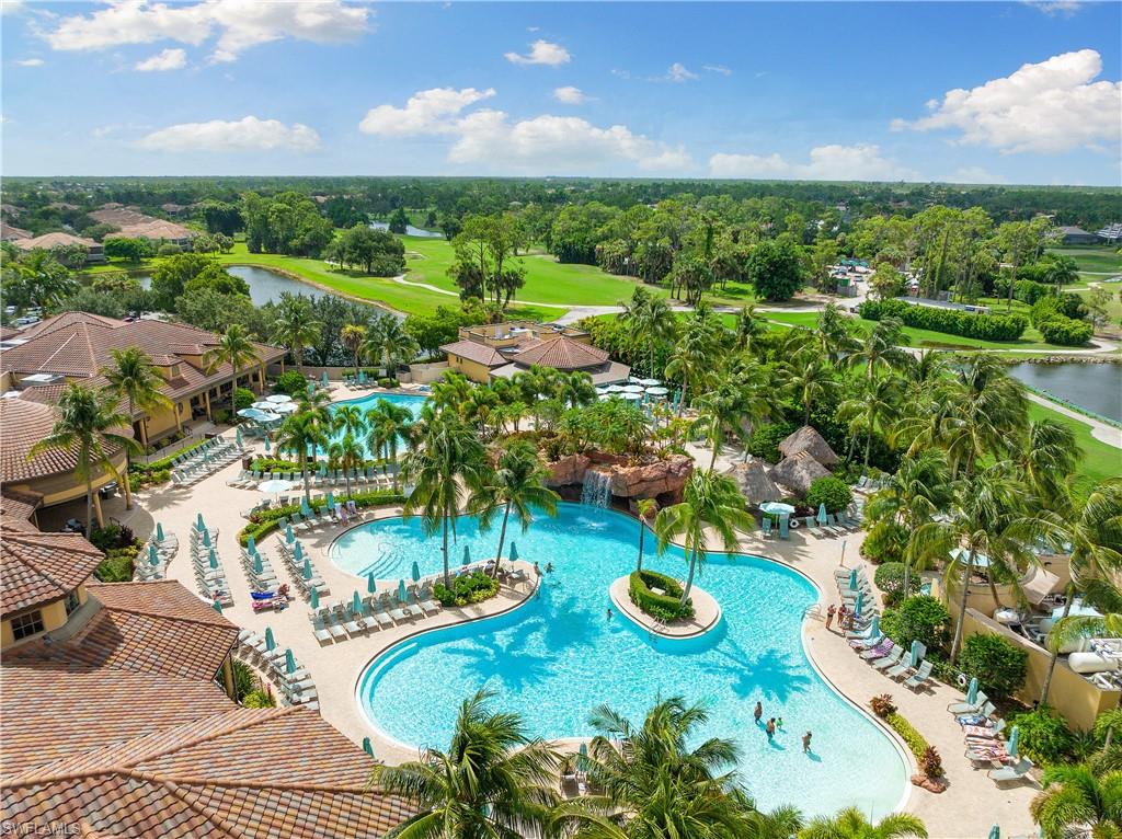7563 Moorgate Point Way Naples, FL 34113 - Photo 38 of 40 an aerial view of a house with yard swimming pool and outdoor seating