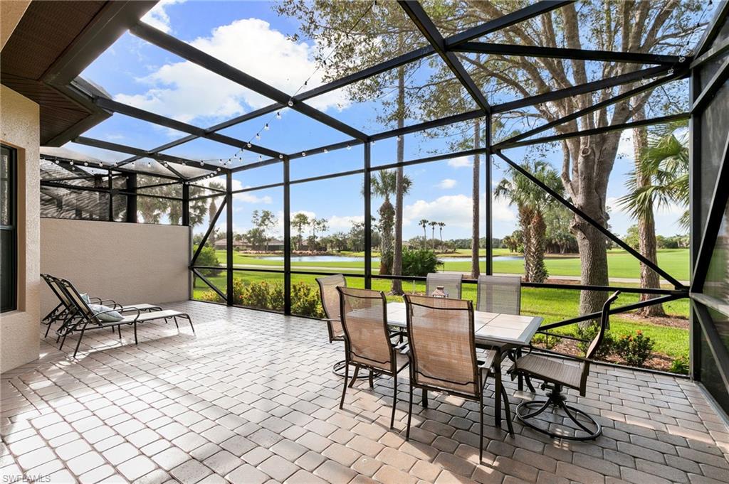 7563 Moorgate Point Way Naples, FL 34113 - Photo 4 of 40 a view of chairs and table in the patio