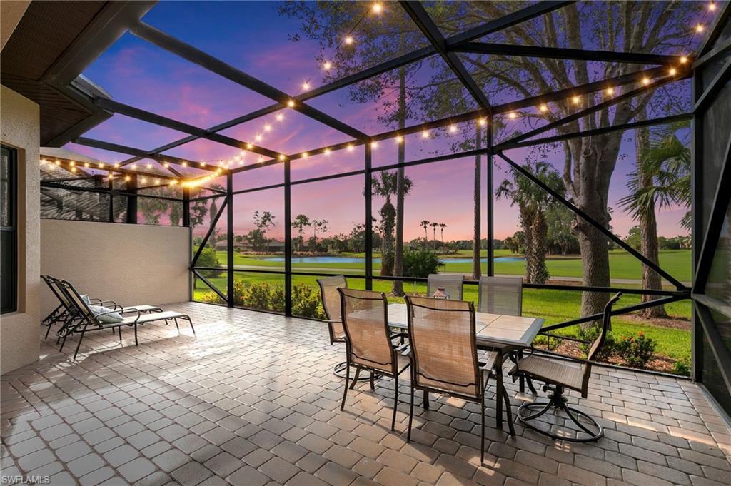 7563 Moorgate Point Way Naples, FL 34113 - Photo 9 of 40 a view of chairs and table in a patio