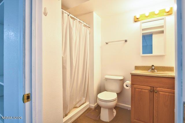 2640 Rockview Drive Reno, NV 89519 - Photo 49 of 56 a bathroom with a toilet a sink and a mirror