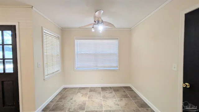 a view of an empty room with a window