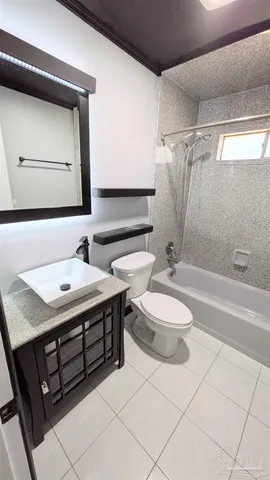 a bathroom with a sink a toilet and a bathtub