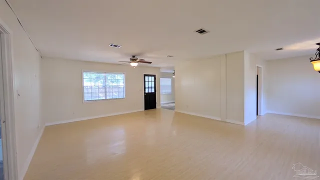 a view of an empty room with a window