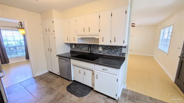 a kitchen with stainless steel appliances granite countertop a stove and a refrigerator