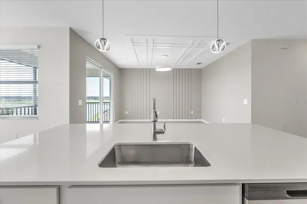 a kitchen with a sink and a window