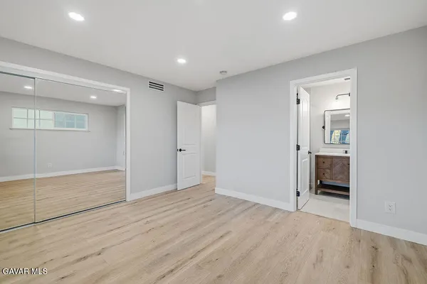 wooden floor in an empty room with an entryway
