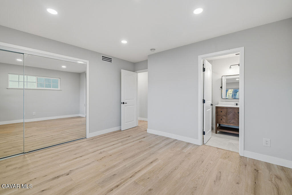 10557 Reseda Boulevard Porter Ranch, CA 91326 - Photo 15 of 37 wooden floor in an empty room with an entryway
