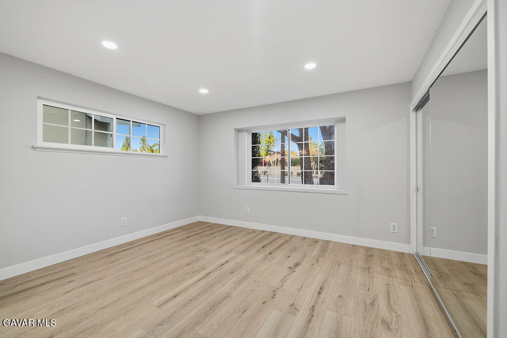 10557 Reseda Boulevard Porter Ranch, CA 91326 - Photo 16 of 37 a view of empty room with wooden floor and fan