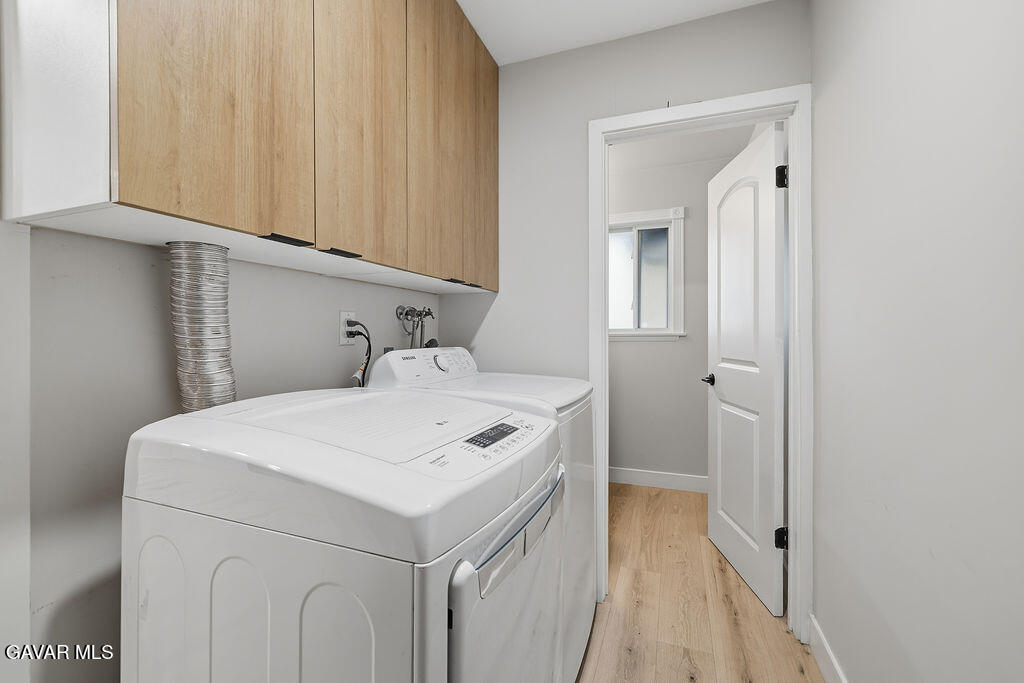 10557 Reseda Boulevard Porter Ranch, CA 91326 - Photo 26 of 37 a utility room with dryer and washer