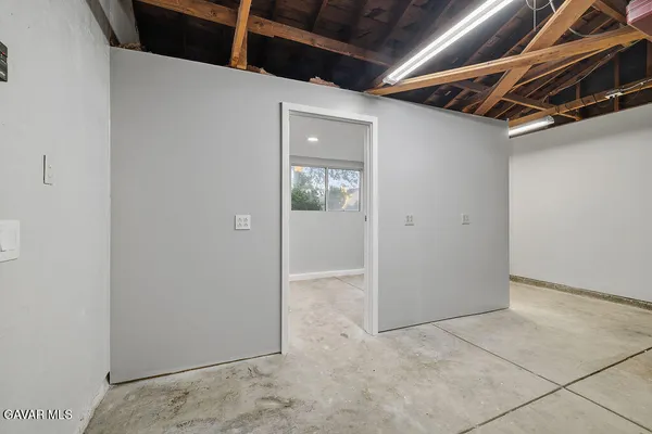 an aerial view of a house with a garden and mountain view