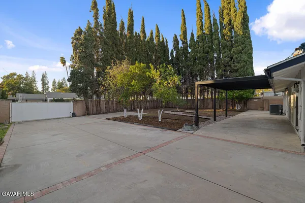 a view of outdoor space with seating and green space