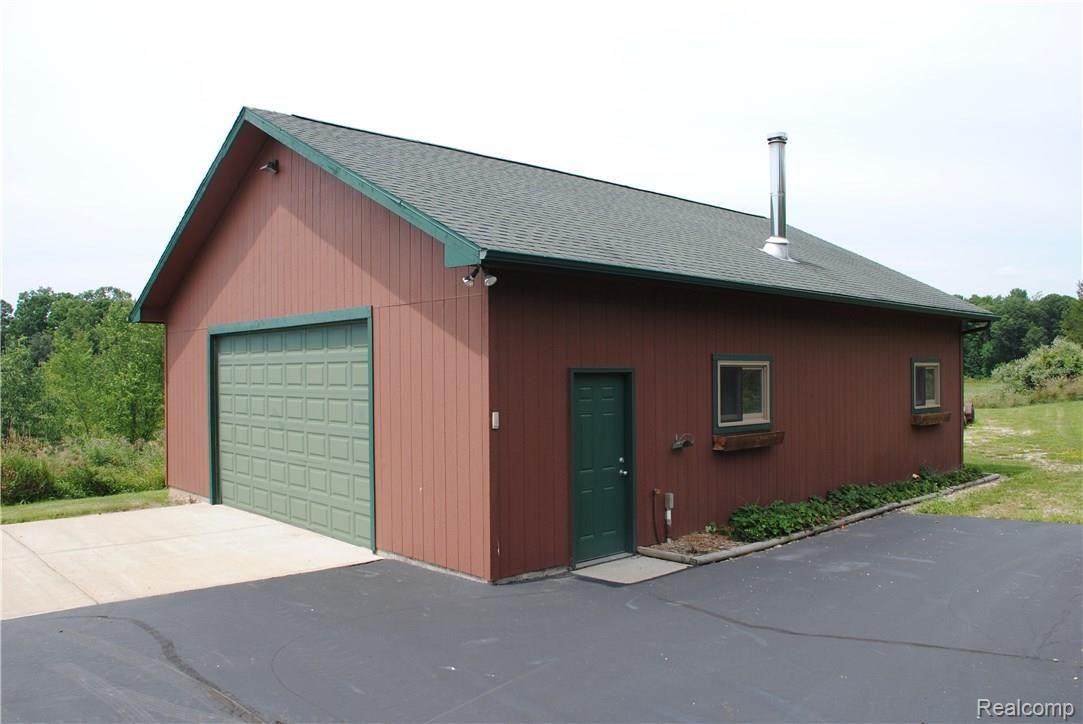 2497 East Clyde Road Howell, MI 48855 - Photo 27 of 95 30' x 40' Garage w/workshop area & Wood Stove.
