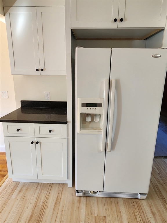 236 Pondview Drive Springfield, MA 01118 - Photo 15 of 23 a white refrigerator freezer sitting inside of a kitchen