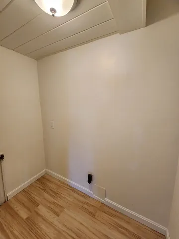 a view of small space with wooden floor