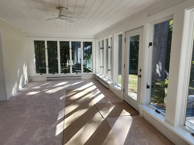a view of a balcony with wooden floor