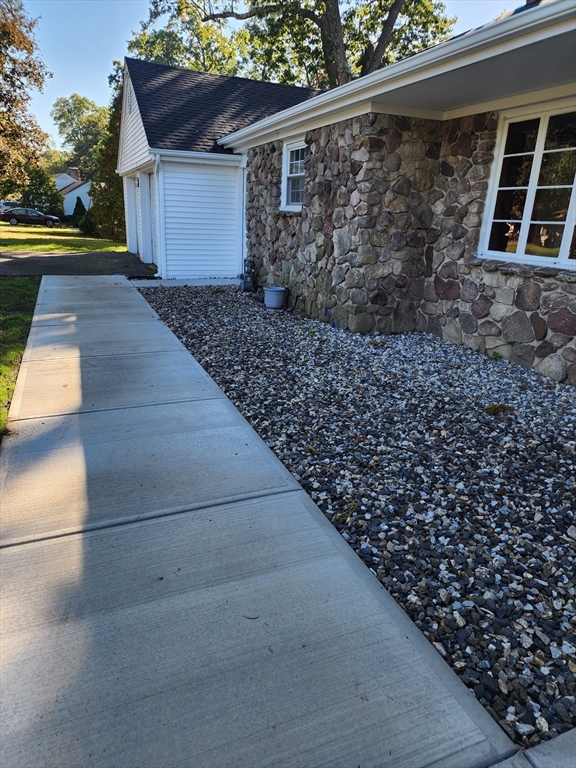 236 Pondview Drive Springfield, MA 01118 - Photo 2 of 23 a view of a yard with wooden fence