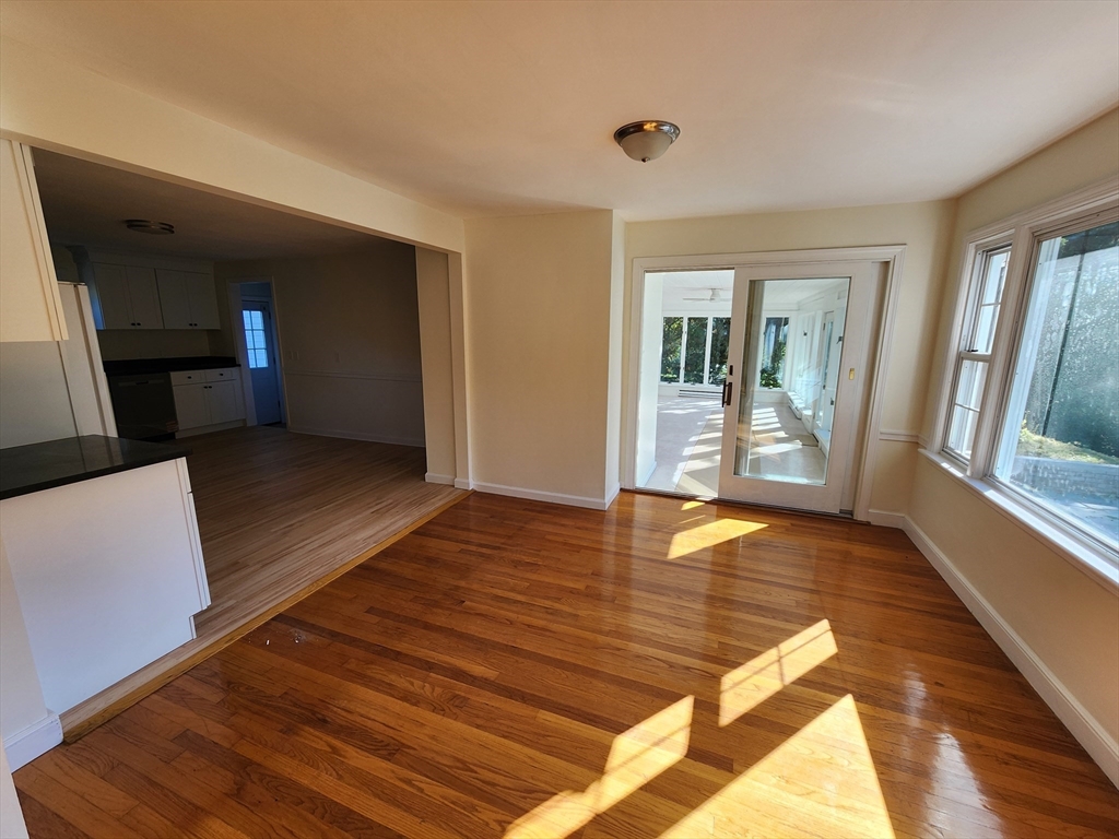 236 Pondview Drive Springfield, MA 01118 - Photo 8 of 23 a view of a living room with wooden floor and a window