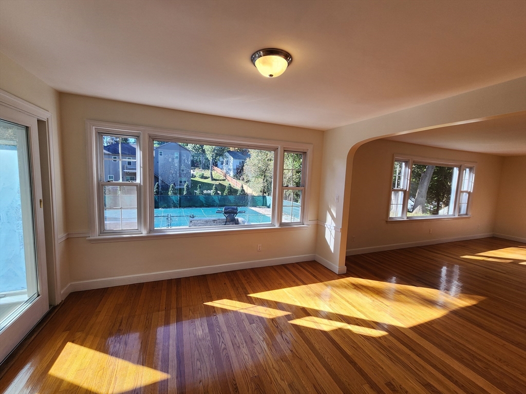 236 Pondview Drive Springfield, MA 01118 - Photo 9 of 23 a room with a bed and wooden floor