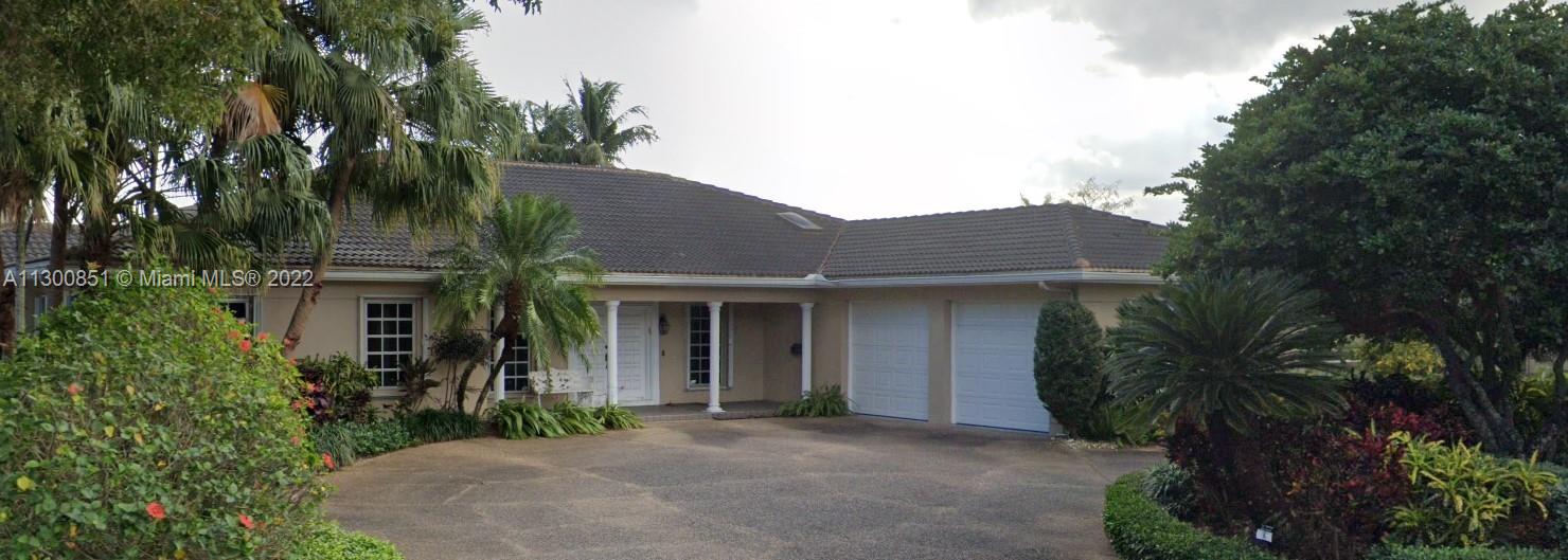 4430 Casper Court Hollywood, FL 33021 - Photo 2 of 2 a front view of a house with yard and green space