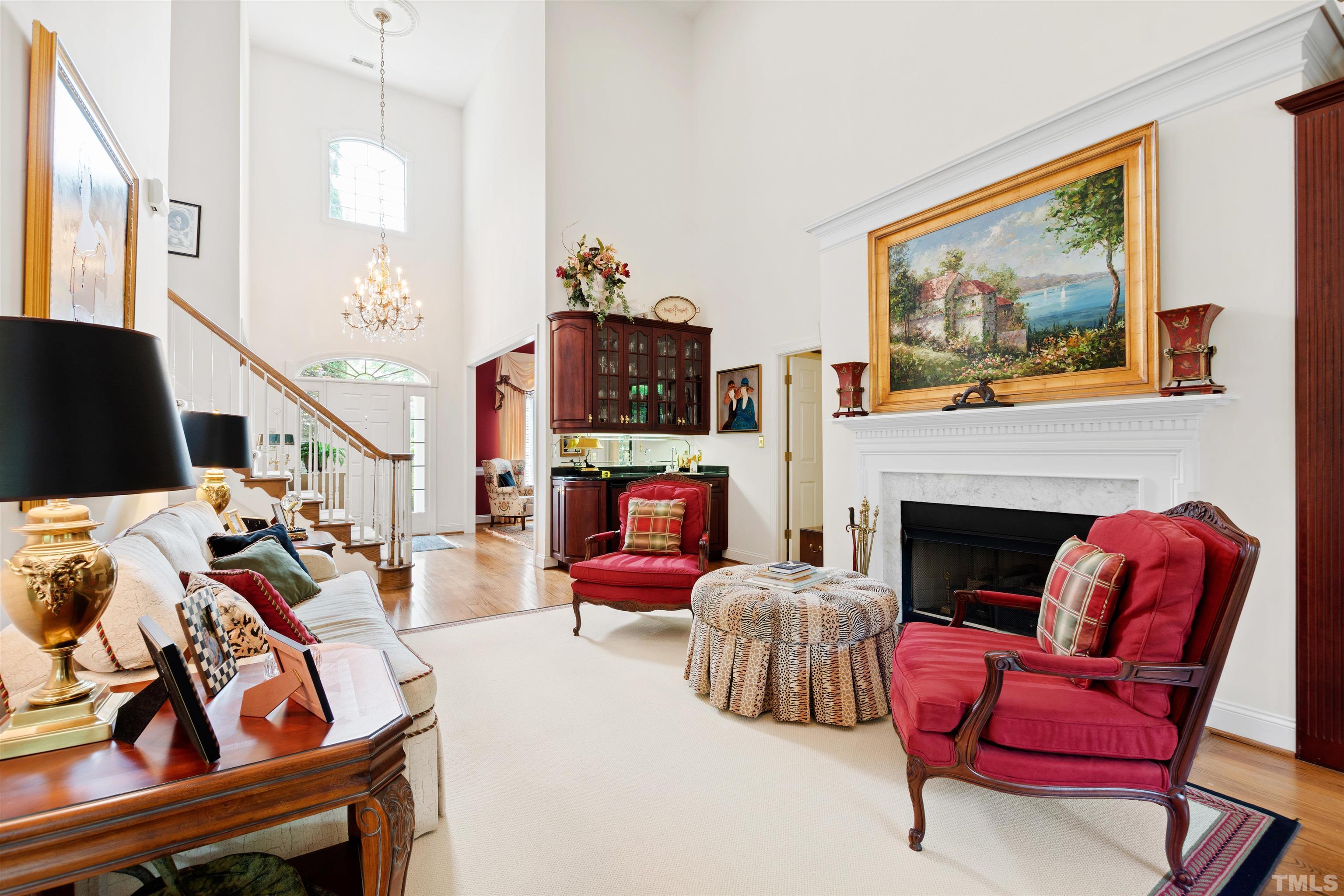 306 Lake Boone Trail Raleigh, NC 27608 - Photo 12 of 55 a living room with furniture a flat screen tv and a fireplace