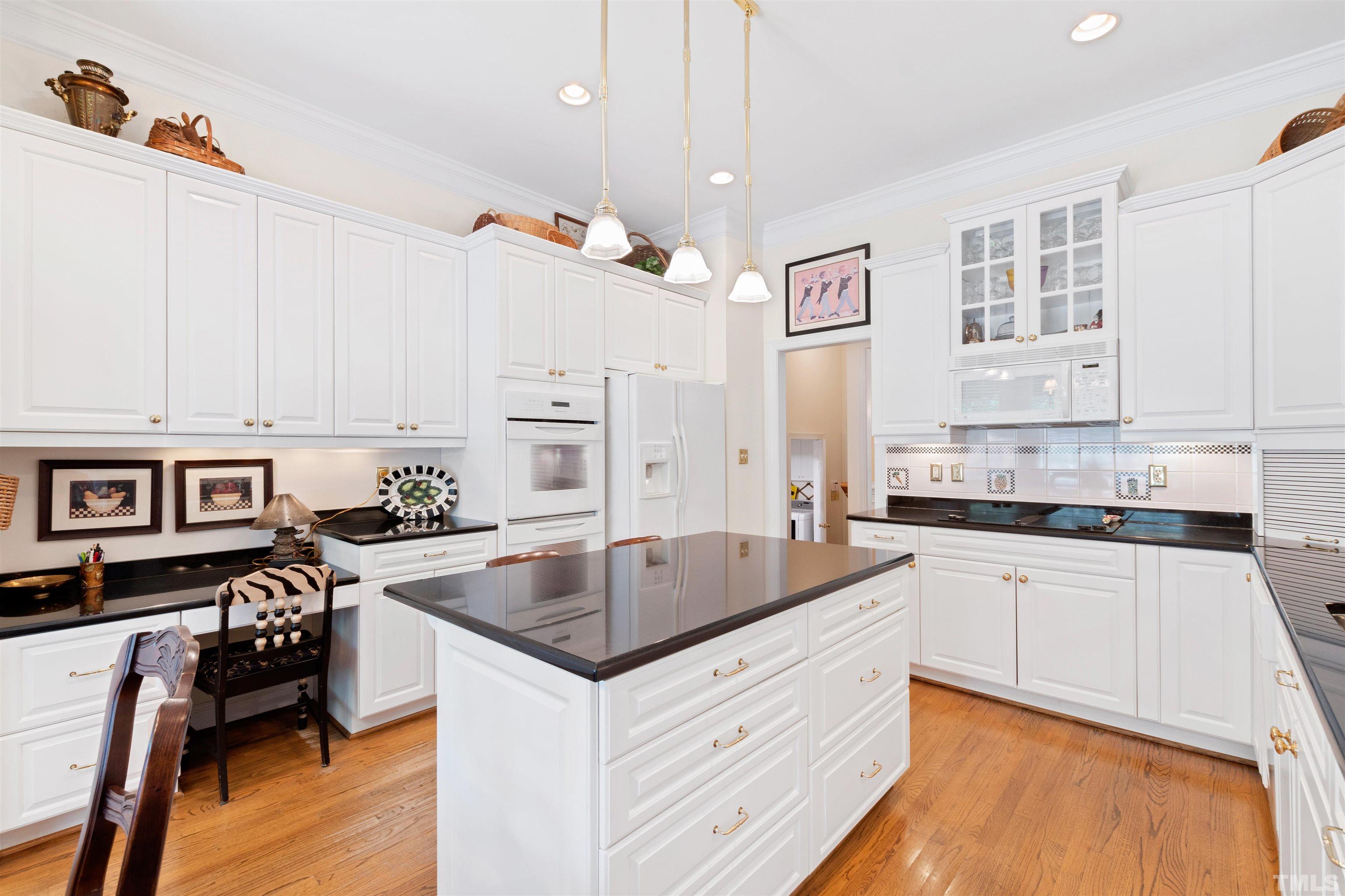 306 Lake Boone Trail Raleigh, NC 27608 - Photo 16 of 55 a kitchen with granite countertop a sink stove and refrigerator